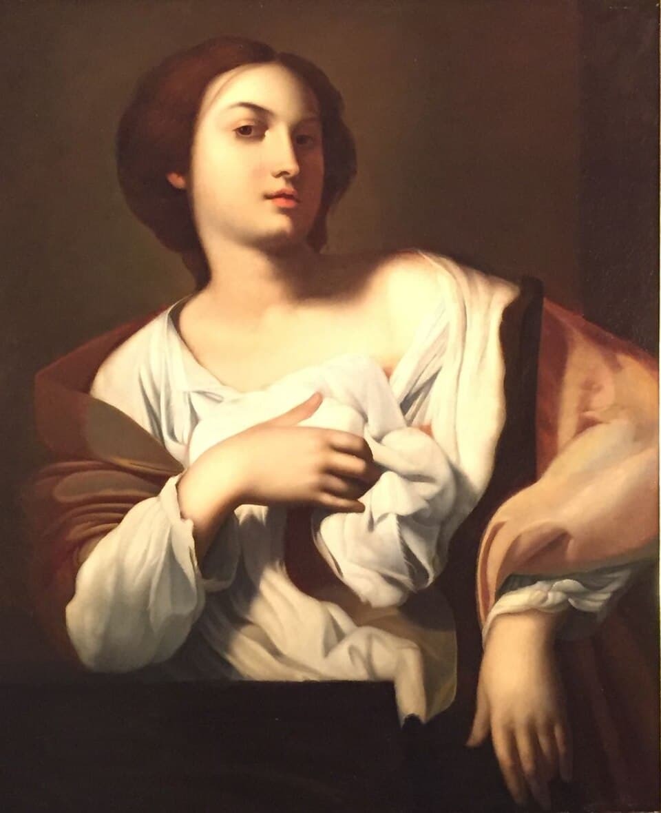 A painting of Saint Agatha as a young woman in a white shift and red mantle, one hand drawn across her breast, looking away from the viewer