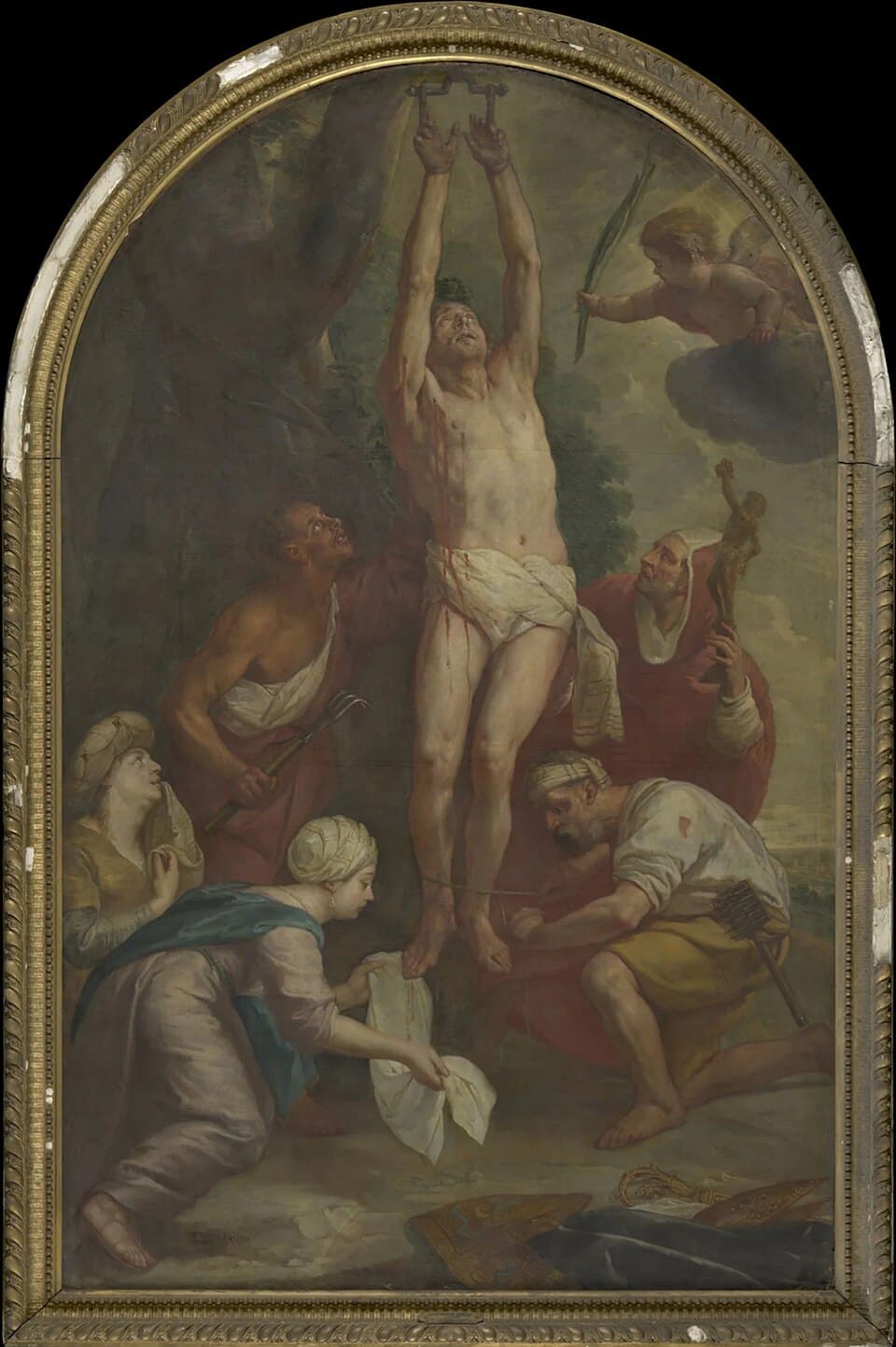 A framed altarpiece painting of the martyrdom of Saint Blaise, hung by the wrists from a tree while two executioners hold iron combs and women kneel below