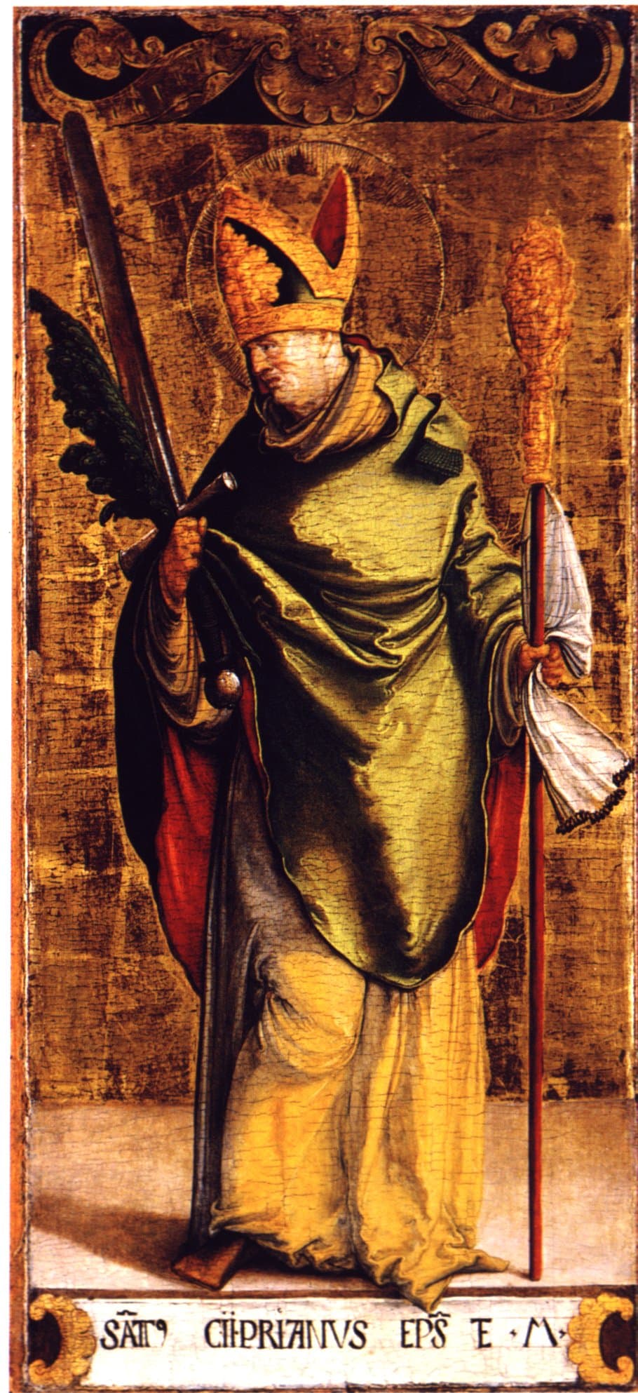 A painted panel of Cyprian of Carthage standing against a gold ground in a gold mitre and olive vestments over red, gripping a martyr's palm and a sword in one hand and a red staff in the other, with his name lettered on a scroll at his feet