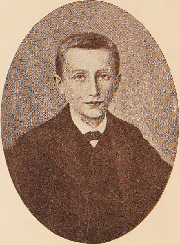 An oval portrait of Dominic Savio as a boy in a dark jacket and white collar, looking directly out