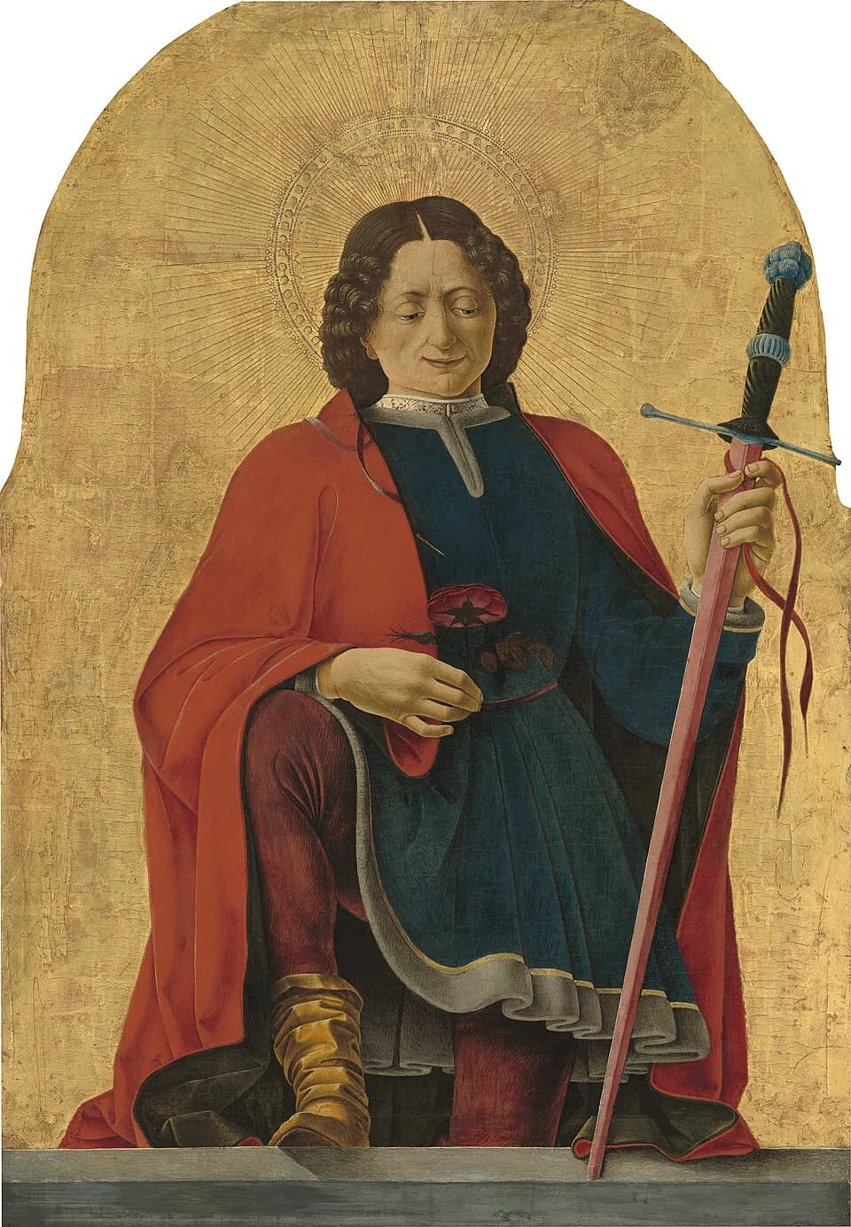 A young man with dark curly hair and a halo, in a red cloak and blue tunic, holds a red rose and leans on a long sword against a gold background