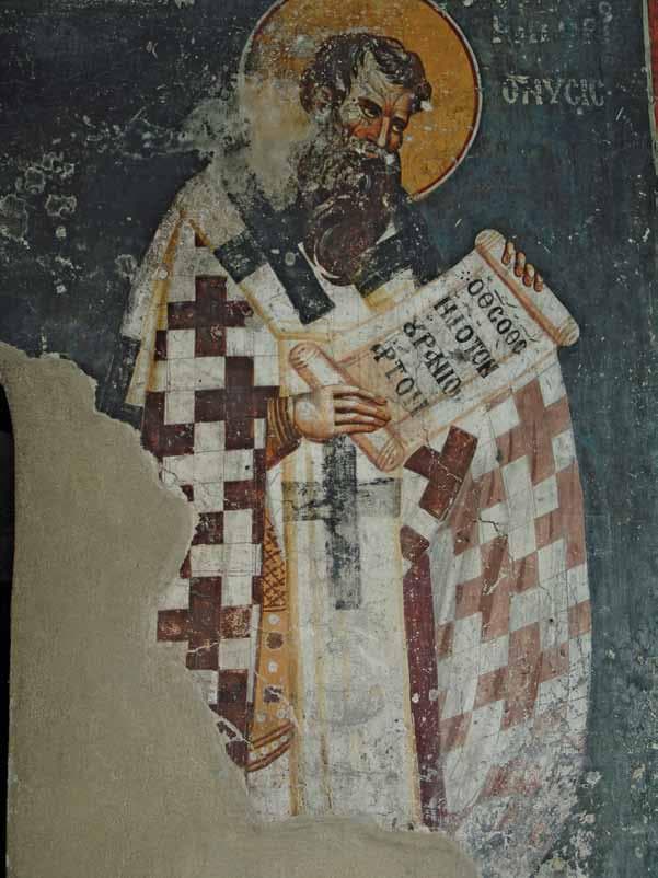 A damaged thirteenth-century fresco of Saint Gregory of Nyssa in cross-patterned bishop's vestments, holding an open scroll lettered in Greek, with plaster lost from the lower corner