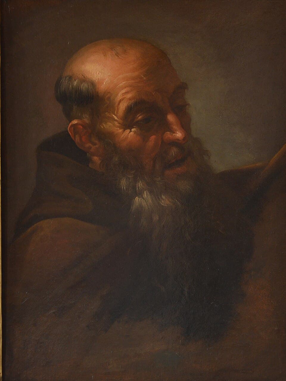 An oil study of Saint Lawrence of Brindisi as a bearded Capuchin friar in a brown habit and hood, his head turned and lit from the side against a dark ground
