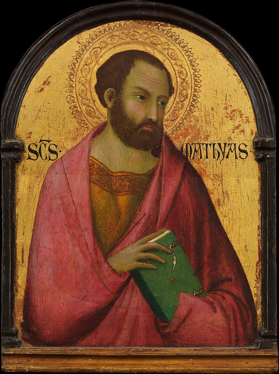 A gold-ground panel of Saint Matthias as a bearded man in a rose-pink mantle over a gold tunic, holding a green book, with his name lettered beside the halo