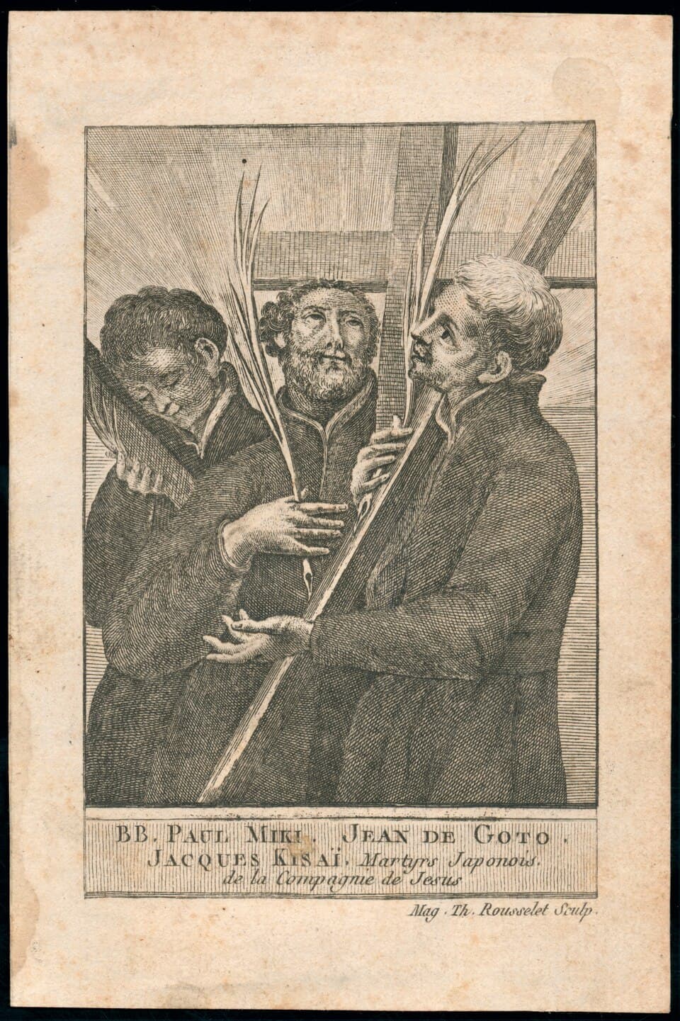 An engraved devotional card of three Jesuits standing before a large cross, holding palm branches, one resting his head against the cross, with their names lettered beneath in French
