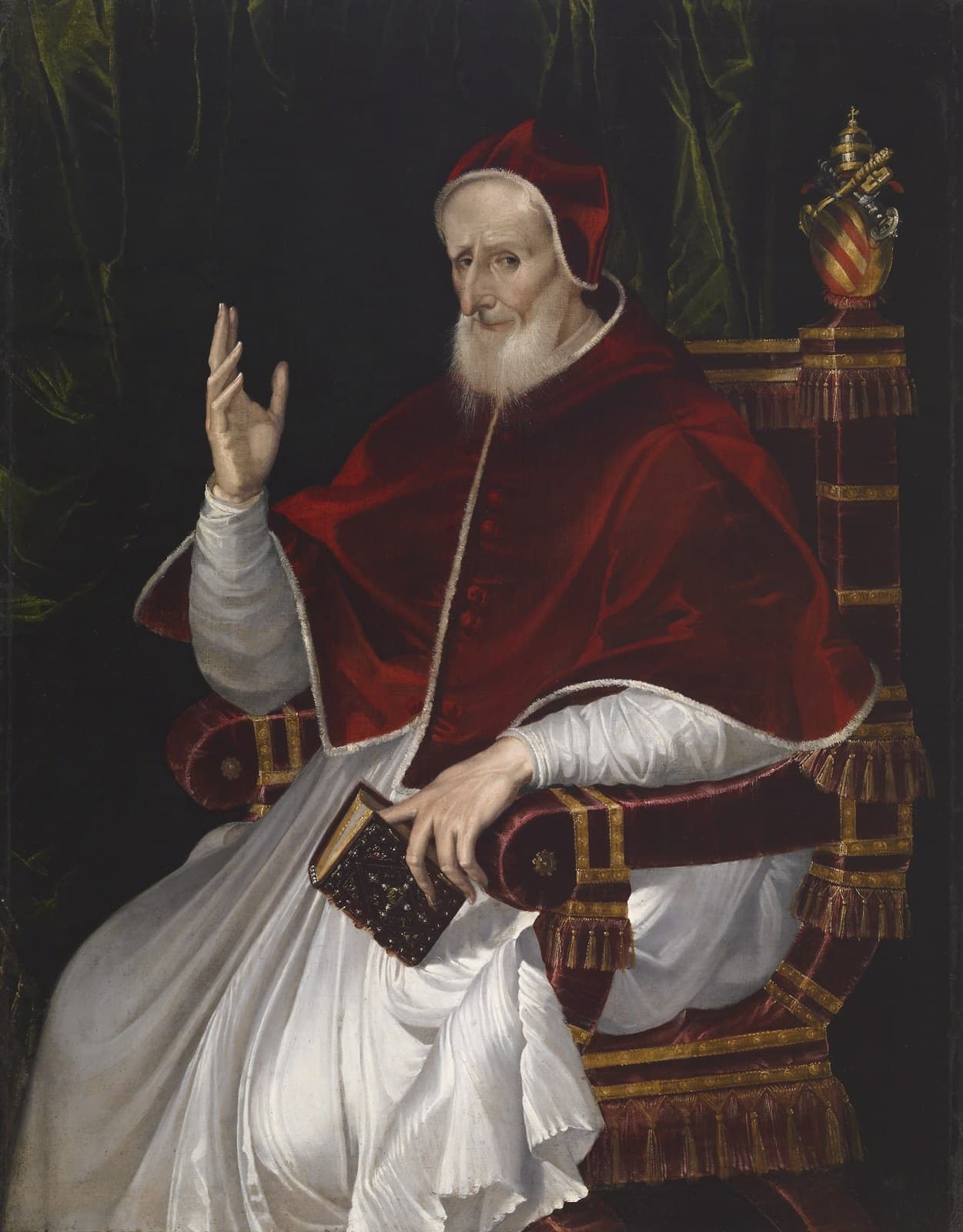 Passarotti's portrait of Pius V enthroned in a red mozzetta over his white habit, turning toward the viewer with his right hand raised in blessing, the Ghislieri arms on the throne behind him