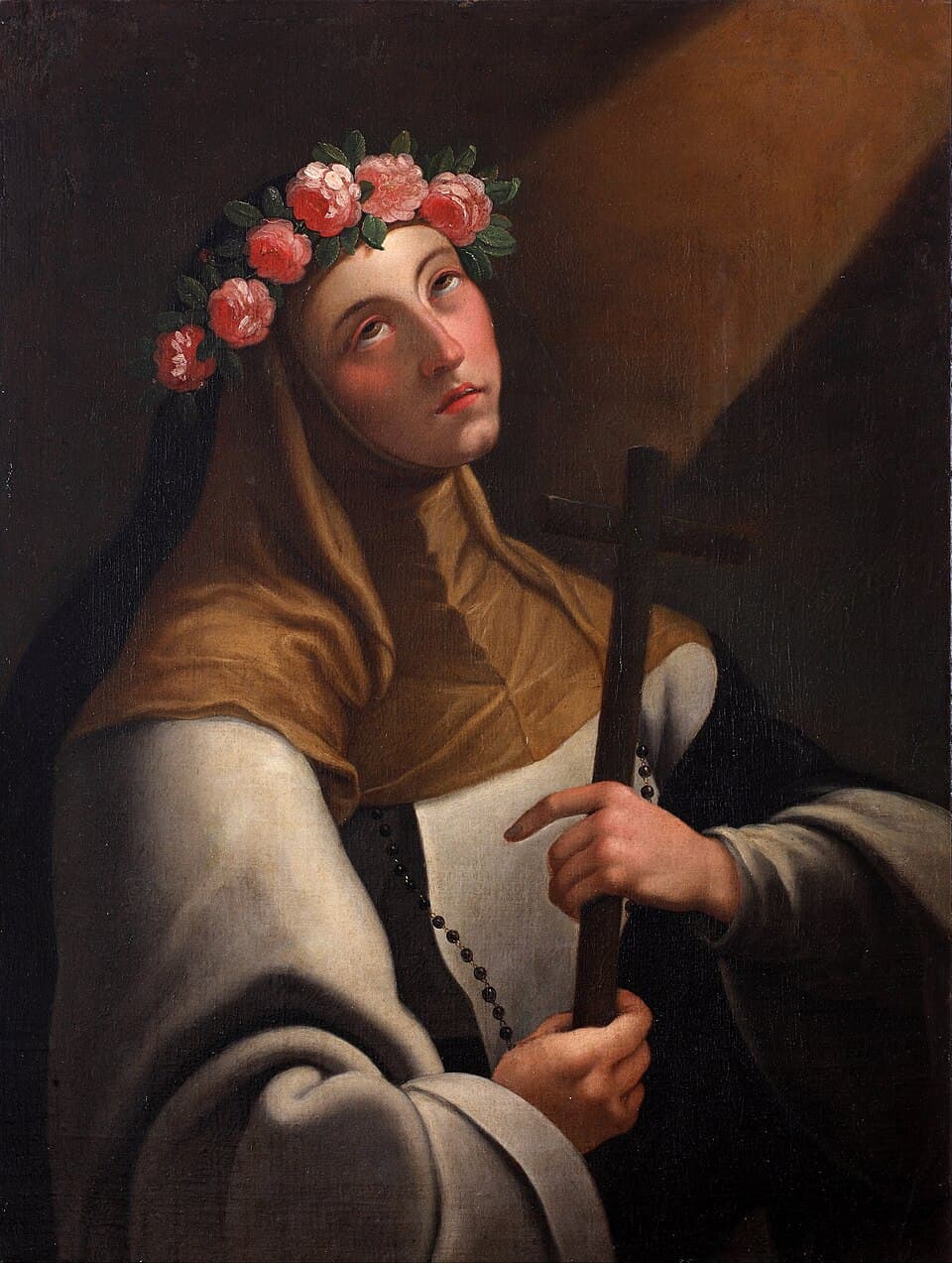 A painting of Saint Rose of Lima in the white habit and black veil of a Dominican tertiary, wearing a crown of pink roses and holding a plain wooden cross, a rosary at her waist