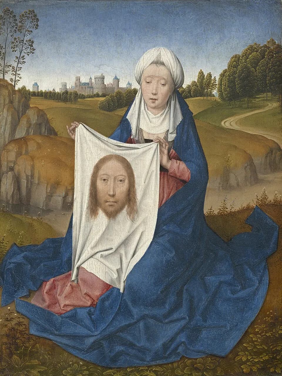 Fifteenth-century Netherlandish painting of a woman in a white headdress and deep blue mantle kneeling in a green landscape, holding up a white cloth that bears the face of Christ, with a walled city in the distance