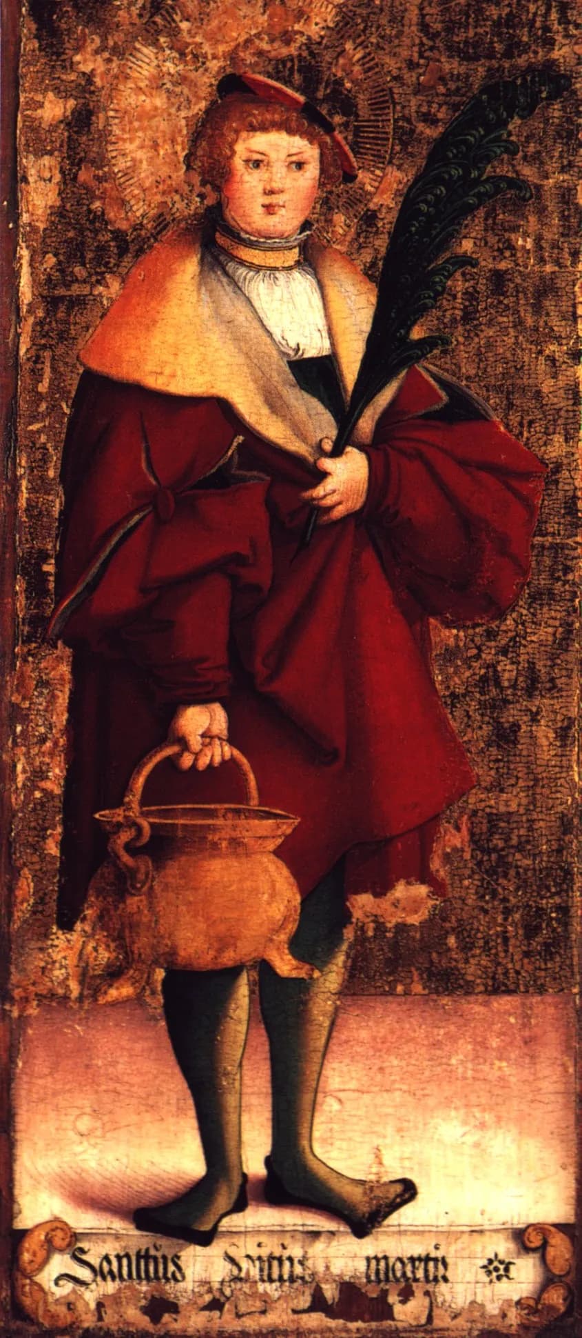 A full-length painting of a curly-haired young man in a red cap and a long red cloak with a pale collar, holding a green palm branch in one hand and a bronze cooking pot by its handle in the other, above a painted inscription naming him as Saint Vitus, martyr