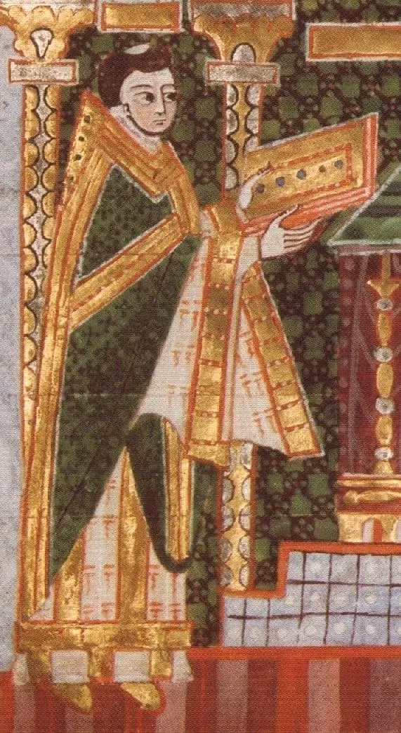 Detail of an illuminated manuscript page showing a tonsured bishop in a green chasuble with broad gold bands, standing under a gold arch and holding out a jeweled book toward an altar