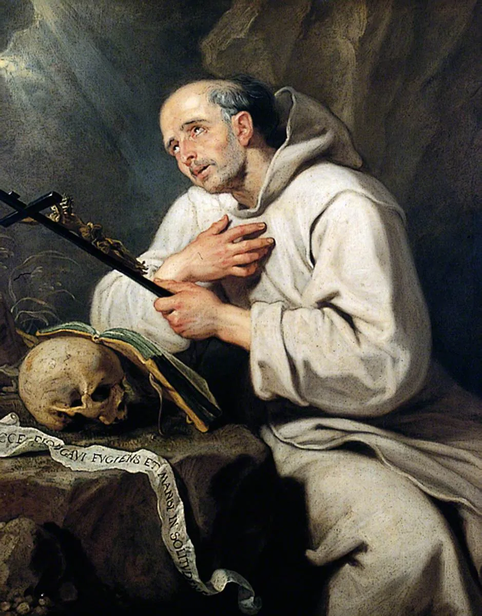 Pintura de San Bruno arrodillado en una cueva rocosa con el hábito blanco con capucha de los cartujos, abrazando un crucifijo, con una calavera y un libro abierto a su lado y un rollo que dice Ecce elongavi fugiens et mansi in solitudine