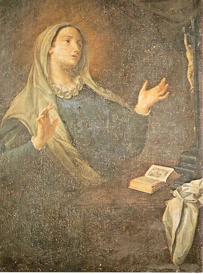 Pintura del siglo XVIII de Catalina de Génova con un velo claro y un vestido gris azulado con una pequeña gorguera blanca, con las manos alzadas y la mirada vuelta hacia un crucifijo a la derecha, con un libro abierto sobre la mesa ante ella