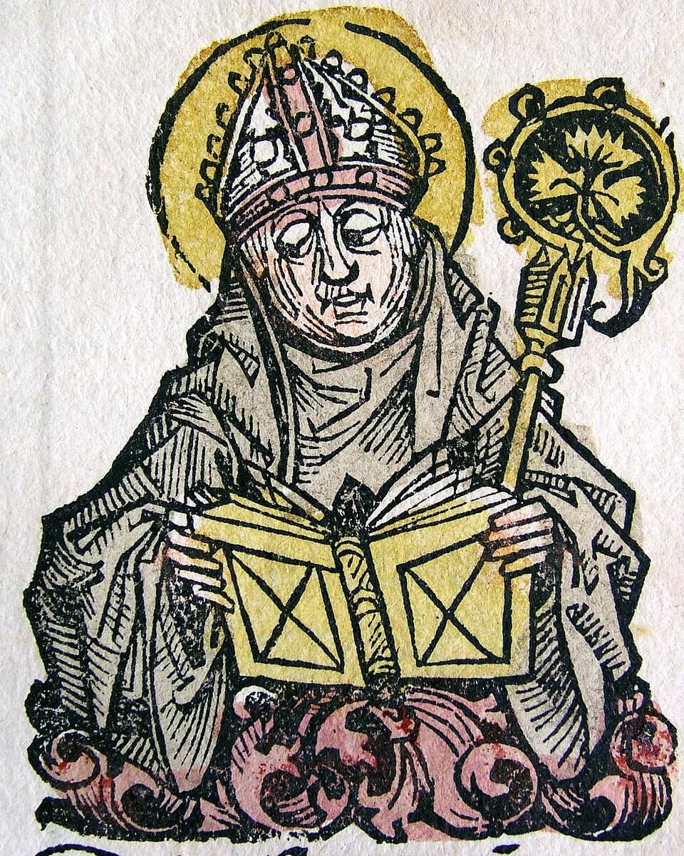 Hand-colored woodcut of a bishop with a halo, wearing a jeweled miter and a gray hooded cloak, reading from an open book held in both hands with a gold crozier resting on his shoulder