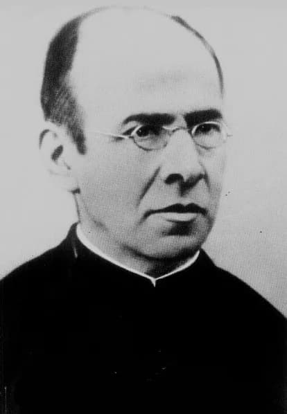 A black-and-white photograph of Father Faustino Míguez in middle age, balding, in round wire-rimmed glasses and a black cassock with a white collar, looking to one side