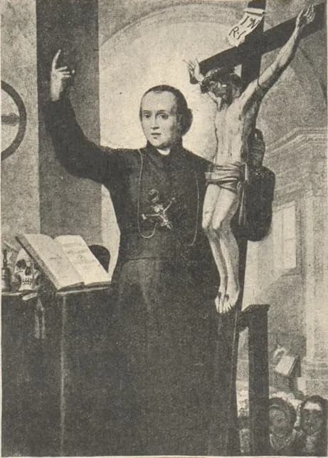 Black-and-white reproduction of a painting of a priest in a cassock preaching with his right hand raised, a large crucifix leaning against his left shoulder, an open book and a skull on the table beside him and listeners below