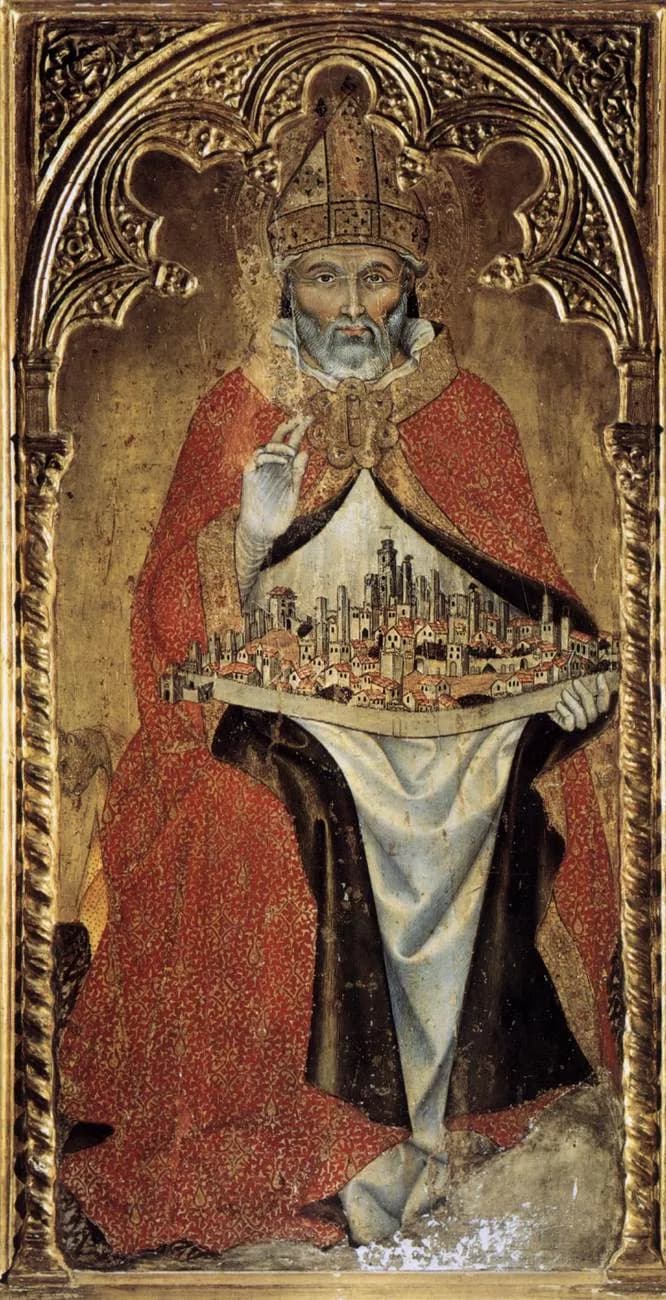 Gothic panel painting of an elderly bearded bishop in a red cope and jeweled miter, seated beneath a carved gold arch, raising his right hand in blessing and holding a walled town of tall towers across his lap