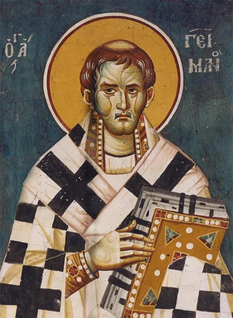Byzantine fresco of Saint Germanus as a bishop with a gold halo, short reddish-brown hair and a lined face, wearing a white vestment patterned with large black crosses and holding a jeweled Gospel book, his name in Greek letters on either side