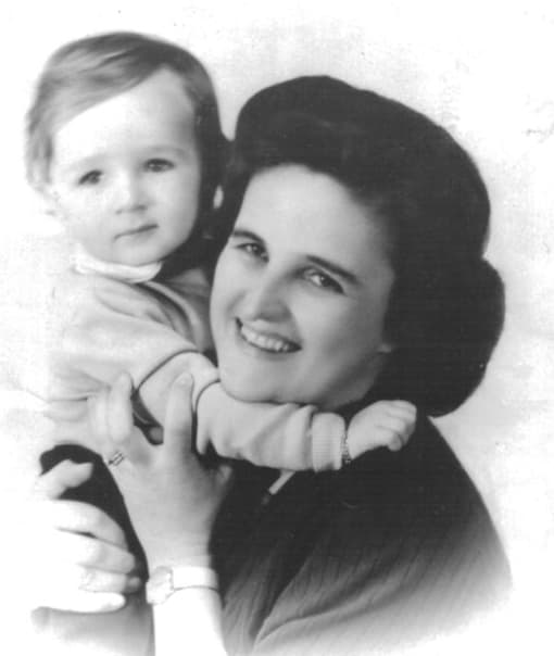 Black-and-white photograph of Gianna Beretta Molla smiling, holding her young son Pierluigi, who has his arm around her neck