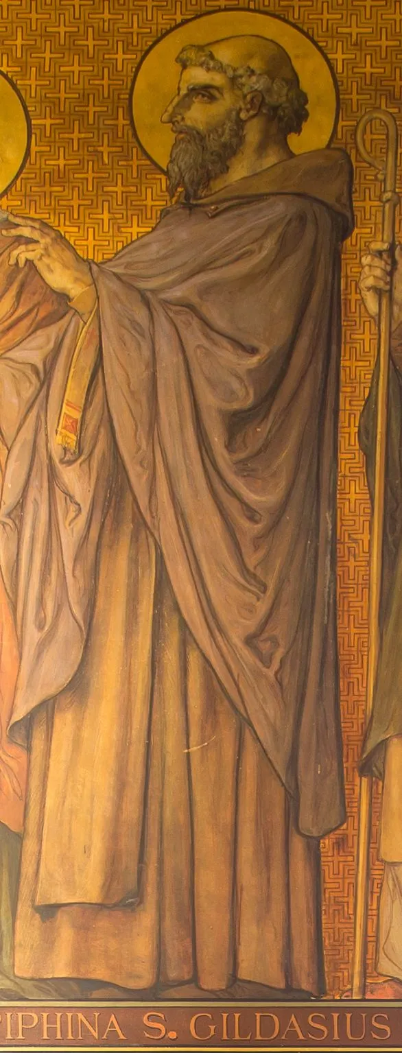 Detail of a nineteenth-century mural on a gold patterned ground: a bearded, tonsured monk with a halo, in a long brown habit and hooded mantle, shown in profile with one hand raised, above the painted caption S. GILDASIUS