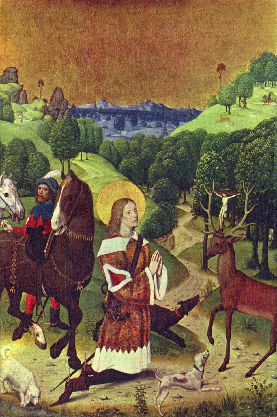 A young haloed huntsman in a patterned red robe kneels with his hands joined before a stag that has a small crucifix standing between its antlers, while a mounted companion, horses and hunting dogs wait in a wooded landscape