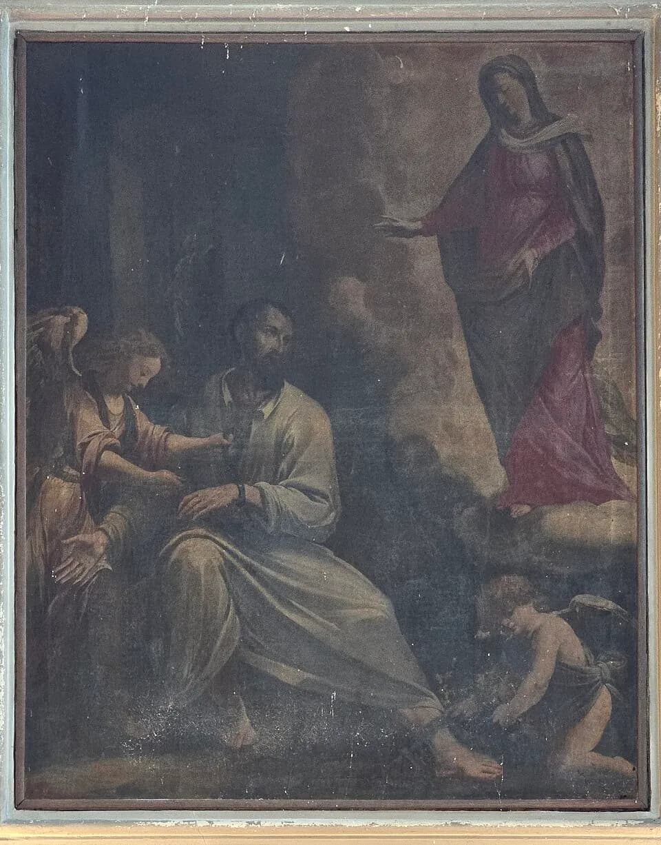 Pintura oscurecida de un altar con la liberación de San Jerónimo Emiliani: el prisionero barbado sentado en una celda mientras un ángel le suelta las cadenas y la Virgen, con túnica carmesí, está de pie sobre él