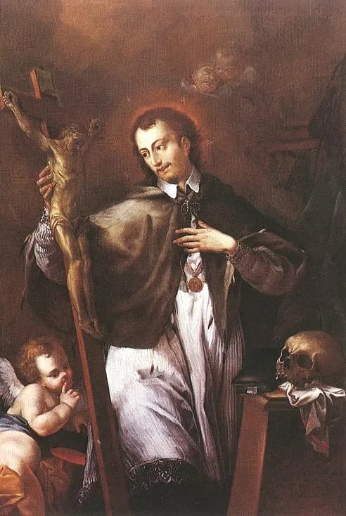 A young priest with a halo, in a white surplice and dark cape, holding a large crucifix and resting his hand on his chest, beside a skull on a table, while a cherub at his feet holds a finger to its lips
