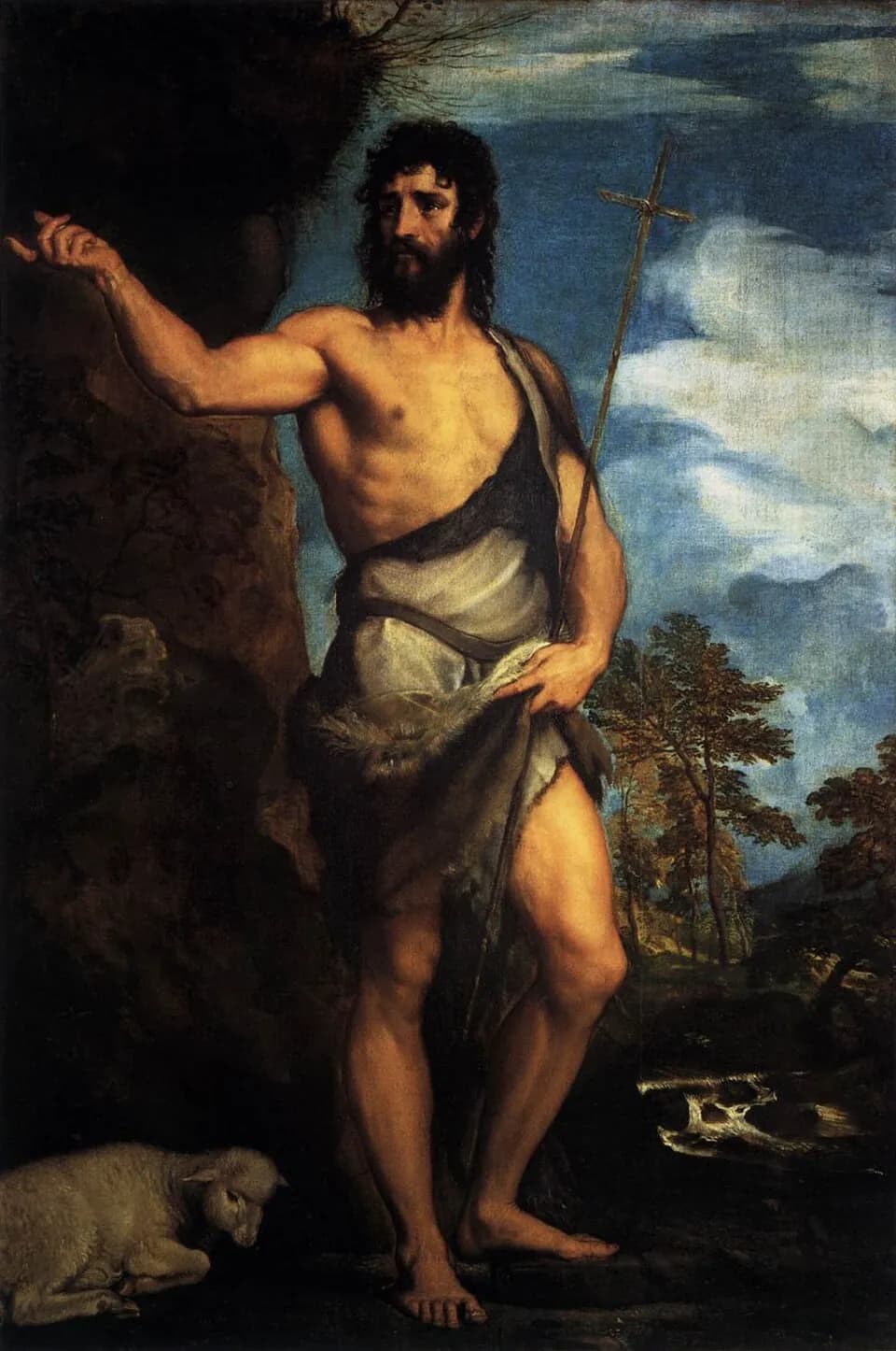 Pintura de Tiziano de Juan el Bautista de pie y descalzo en el desierto, con una vestidura de piel de camello, sosteniendo una cruz de caña y señalando, con un cordero echado a sus pies