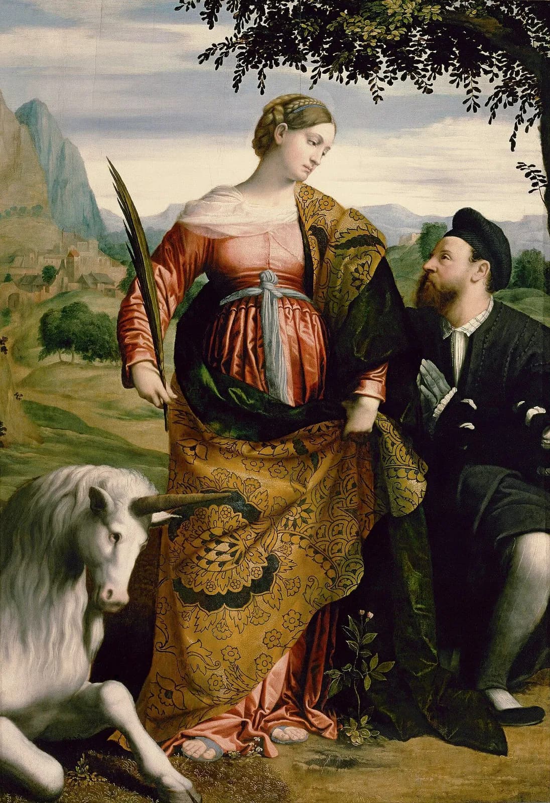 Sixteenth-century Italian painting of a young woman with braided hair in a rose-red gown and a patterned gold and green cloak, holding a palm branch, standing in a landscape with a white unicorn lying at her feet and a bearded man in black kneeling beside her