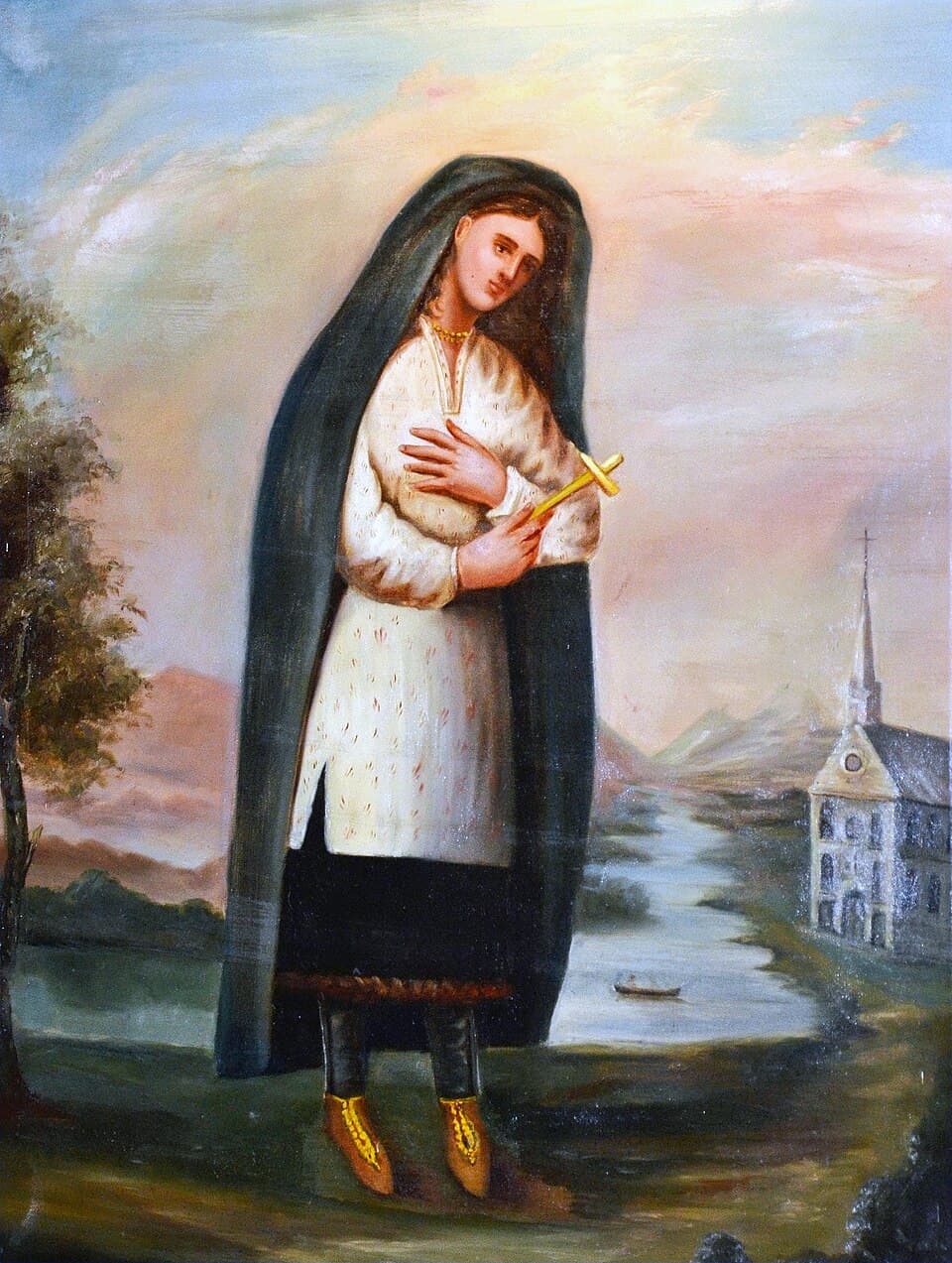 Kateri Tekakwitha standing in a dark blanket over an embroidered white tunic, holding a gold cross against her breast, with a river and a mission church behind her, painted by Joseph Légaré