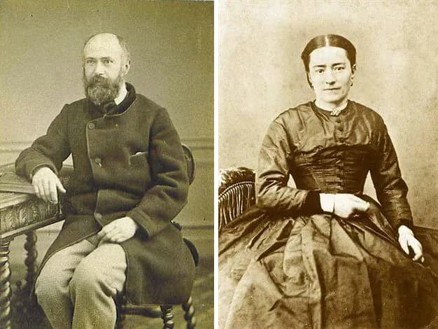 Two sepia studio photographs side by side: on the left Louis Martin, bald and bearded, seated in a long dark coat with his arm on a carved table; on the right Zélie Martin, her hair parted in the center, seated in a dark silk dress with her hands folded