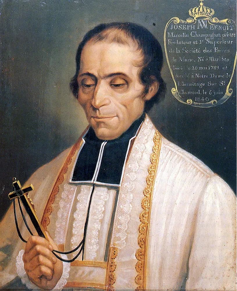 Painted portrait of a priest with dark hair and lowered eyes, wearing a black cassock with white bands under a lace surplice and gold-edged stole, holding up a small crucifix, with a gold cartouche in the corner giving his name and his dates in French