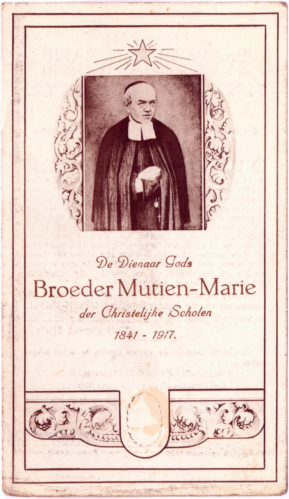 A Flemish holy card showing Brother Mutien-Marie standing in his black habit and white bands, a rosary in his hands, over the words "De Dienaar Gods Broeder Mutien-Marie der Christelijke Scholen 1841-1917"