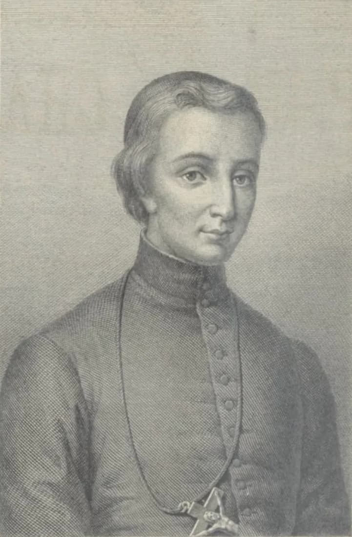 Engraved bust portrait of a young priest with wavy hair, in a buttoned cassock with a high collar and a crucifix on a cord at his chest