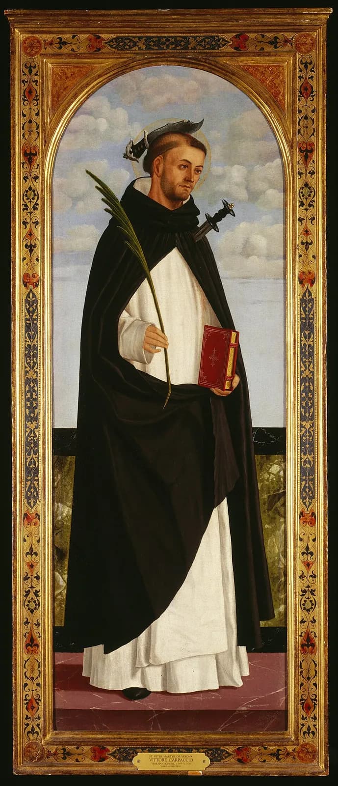 Panel painting of Saint Peter Martyr standing in a black and white Dominican habit against a cloudy sky, holding a palm branch and a red book, with a blade lodged in his head and a dagger in his shoulder, inside an arched gilded frame