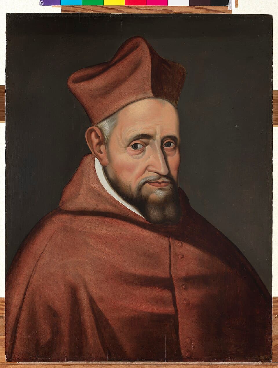 A painted portrait of Cardinal Robert Bellarmine, bearded and in a red biretta and mozzetta, seated and turned slightly toward the viewer