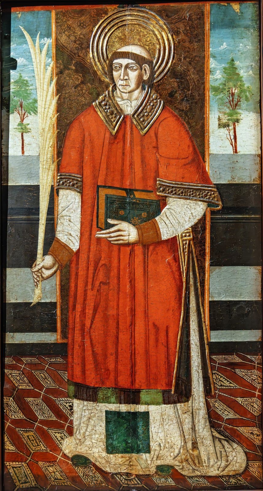 A fifteenth-century Aragonese panel of Saint Vincent of Zaragossa as a deacon in a red dalmatic, holding a martyr's palm and a book
