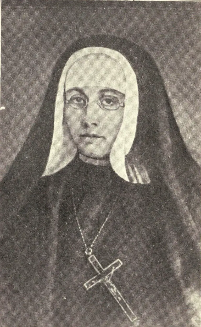 Halftone portrait of Mother Marie-Rose Durocher in a black veil over a white coif, with round wire spectacles and a crucifix hanging from a long cord