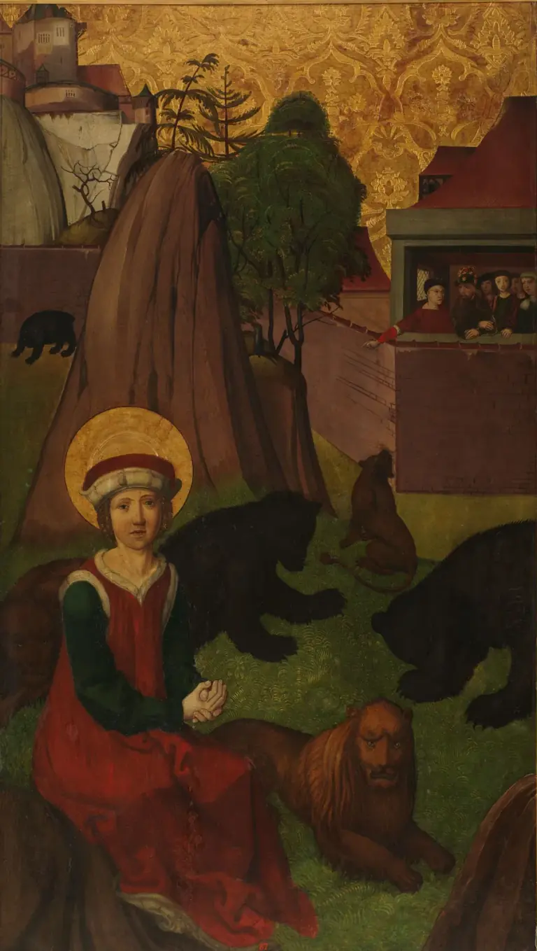Early sixteenth-century painted panel of a haloed youth in a red cap trimmed with white fur and a red gown over green sleeves, sitting calmly on the grass of a walled arena among black bears and two lions, one lying beside him, while a richly dressed group, one man crowned, looks down from a balcony at the upper right, with a castle on the hill behind under a gold patterned sky