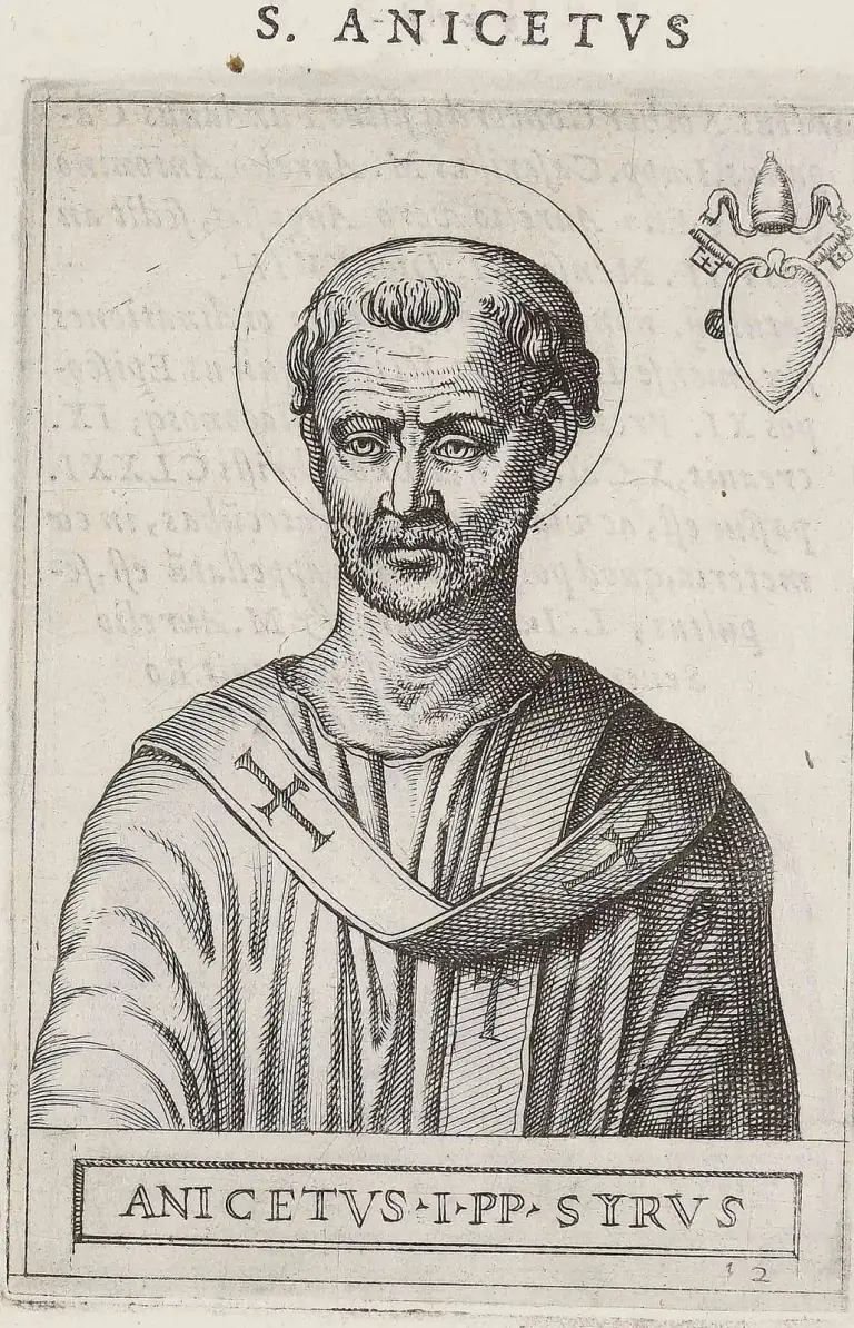 Sixteenth-century engraving of a bearded, tonsured pope with a halo, shown half-length in a cope and a pallium marked with crosses, the papal tiara and crossed keys above a heart-shaped shield in the upper corner, under the heading S. Anicetus and above the caption Anicetus I PP. Syrus