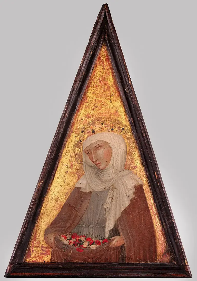 Saint Elizabeth of Hungary veiled in a Franciscan habit against a gold ground, holding roses gathered in her lap, on a triangular painted panel