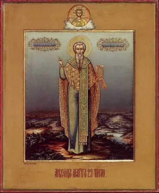 Icono ruso del siglo XIX de un obispo de barba gris con aureola dorada, con vestidura dorada estampada y una larga estola marcada con cruces, de pie en un paisaje con un río y colinas, bendiciendo con la mano derecha y sosteniendo un libro cerrado en la izquierda, con un pequeño medallón de Cristo arriba y una inscripción roja en eslavo eclesiástico al pie que da la fecha del 29 de marzo