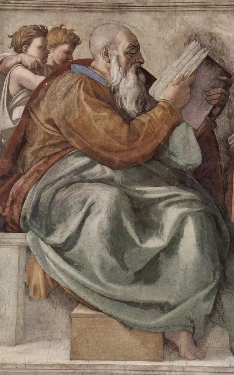 Fresco de un anciano calvo de larga barba blanca, sentado de perfil con un manto pardo rojizo sobre una túnica verde mar, pasando las hojas de un gran libro que sostiene en alto con ambas manos, mientras dos niños de pelo rizado miran desde detrás de su hombro